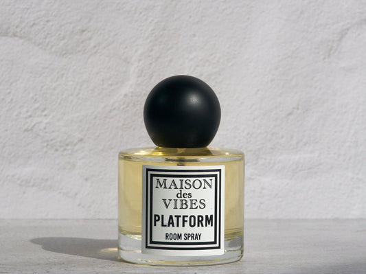 PLATFORM Room Spray in signature clear bottle with black round top and black and white label. Non-toxic room spray formula with natural, organic ingredients.