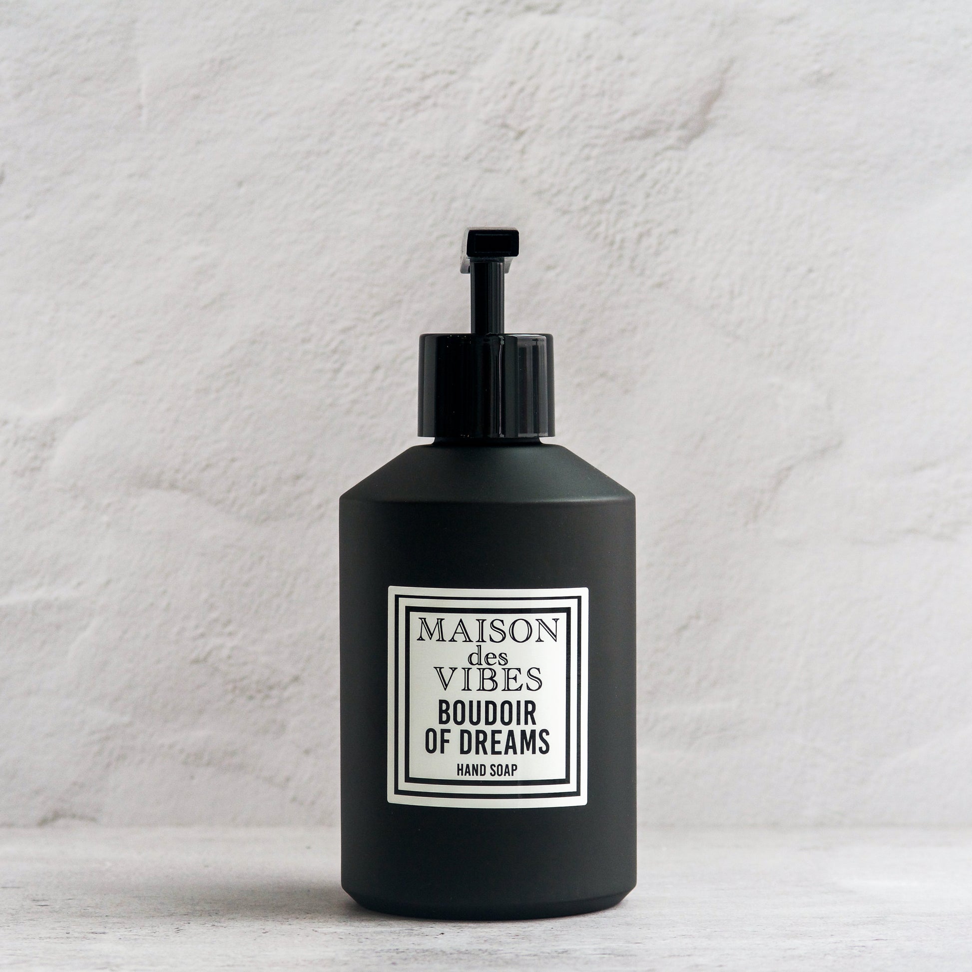 Maison des Vibes' BOUDOIR OF DREAMS liquid hand soap in the classic black bottle with a white and black square logo on a white background. 