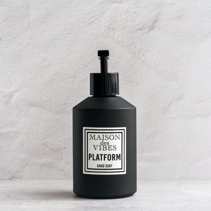 Maison des Vibes' Platform liquid hand soap in the classic black bottle with a white and black square logo on a white background. 