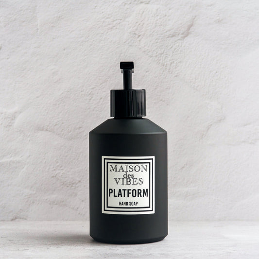 Maison des Vibes' Platform liquid hand soap in the classic black bottle with a white and black square logo on a white background. 